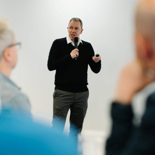 Photograph of Dave Kelly speaking at a conference