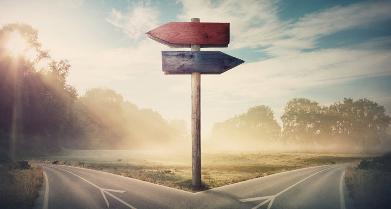 Stylised photograph of a crossroads with a signpost pointing left and right