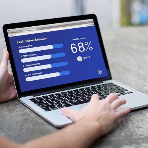 Laptop screen displaying example AI Evaluation results